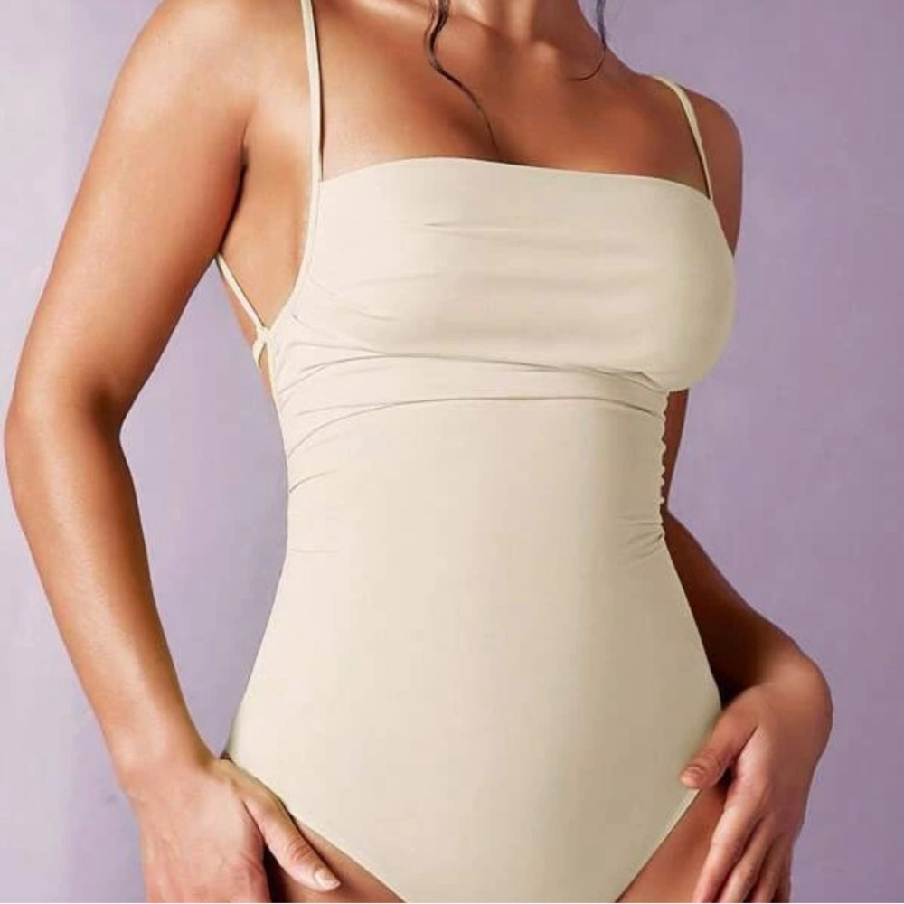 Beige body suit - never worn - size m